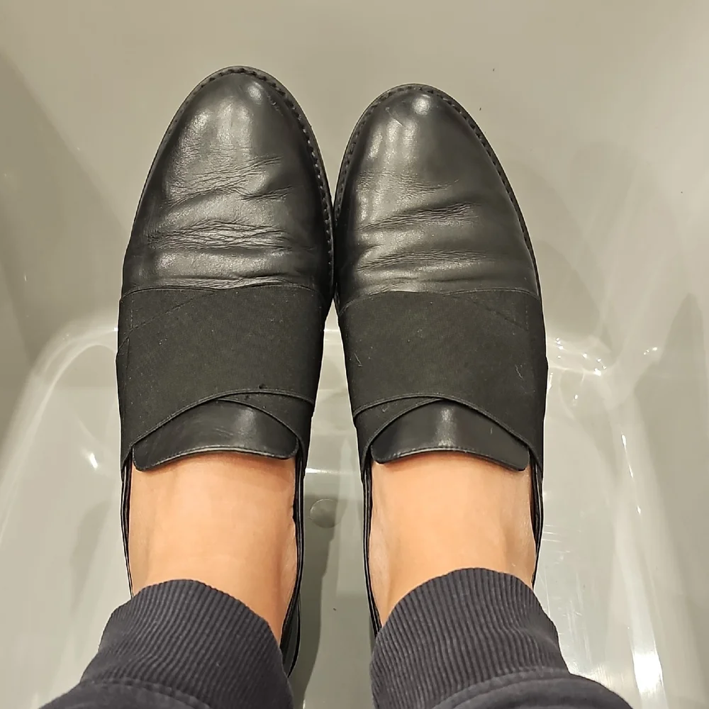 Stuart Weitzman Black Leather Slip-On Loafers